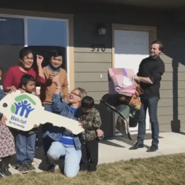 KEPR: Habitat for Humanity Gives Refugee Family Keys to New Home