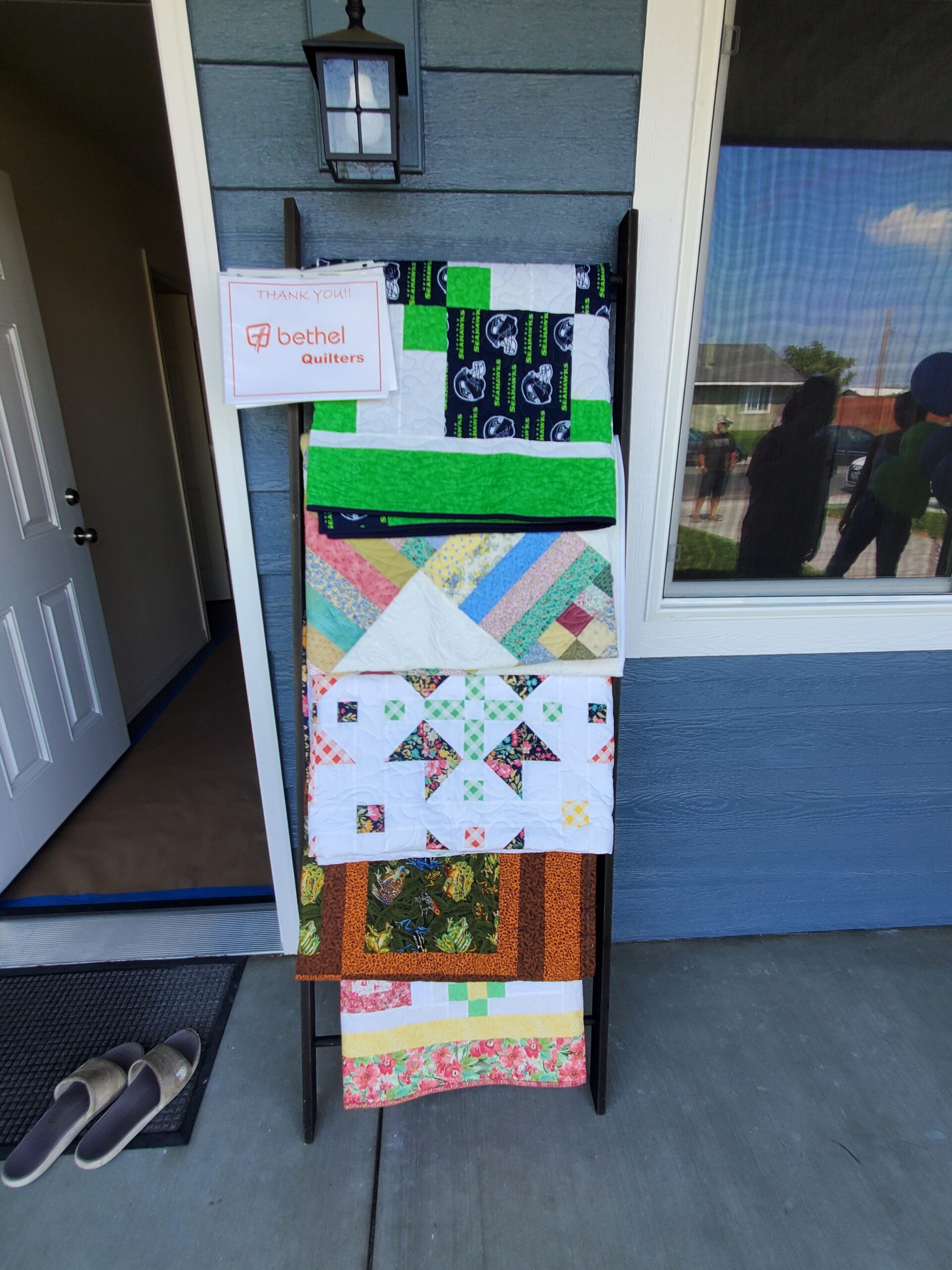 Quilts created by the Bethel Quilters as a homewarming gift at Habitat dedication.